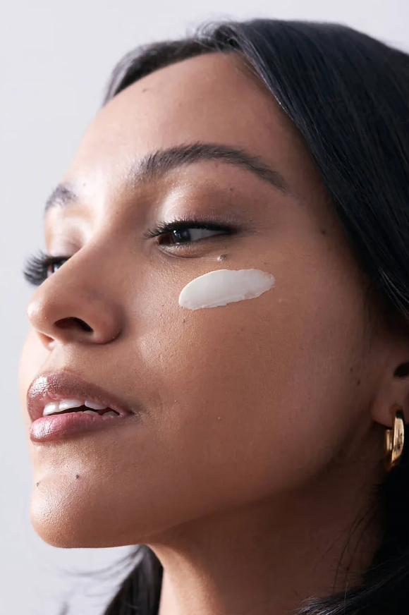 model victoria showing cream application on cheek